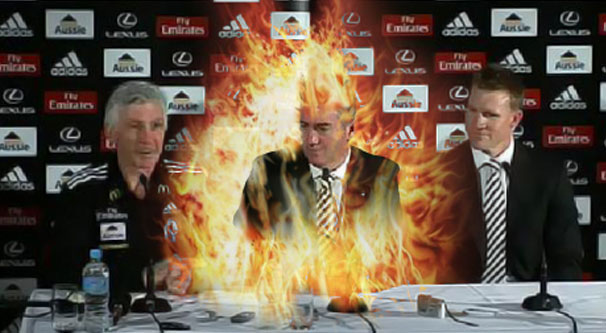 Collingwood coach Mick Malthouse and new Assistant Coach Nathan Buckley watch as Eddie McGuire explodes in flames from sheer joy.