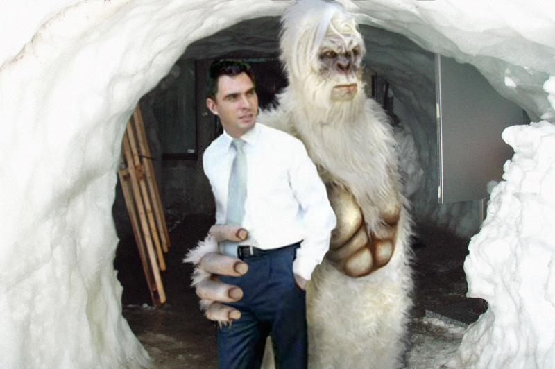 Minister Tim Holding poses for photos with partner the Abominable Snowman at his press conference.